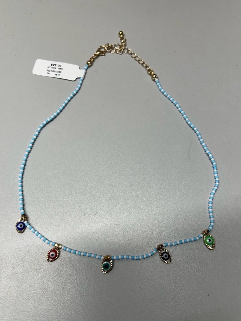 Light Blue Beaded Necklace with Multicolor Eye Charms